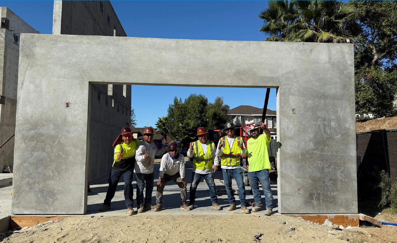 NileBuilt construction crew with concrete panel on job site